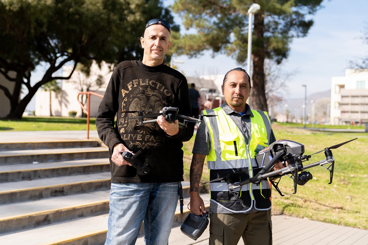 students with drones on campus