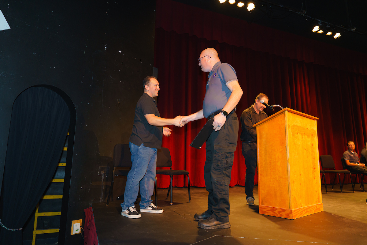 shaking hands with the instructor