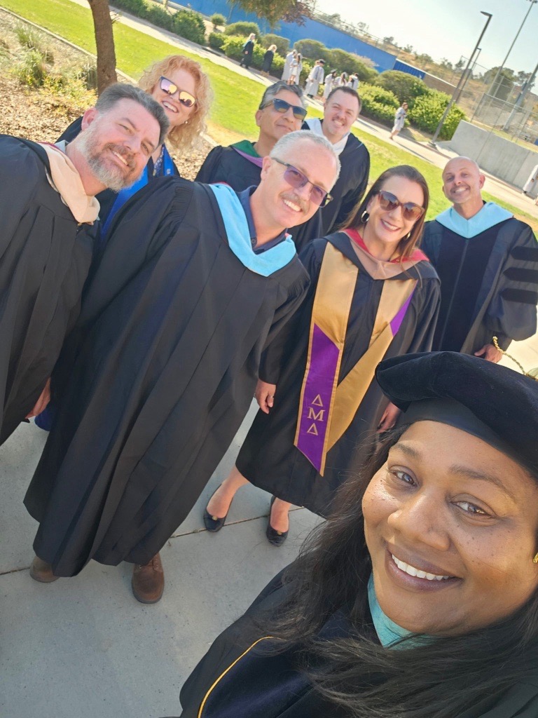 Trustee Sylva with leaders at the Beaumont HS graduation