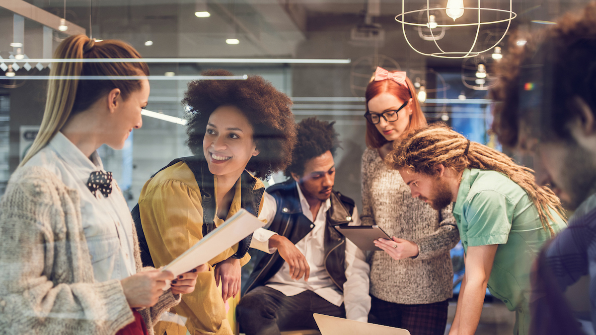 smiling group of people in a meeting